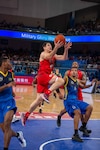 U.S. Navy Lt. Junior Grade Grant Vermeer, U.S Armed Forces Men’s Basketball Team member, soars past a competitor for a layup during the 7th Conseil International du Sport Militaire World Games in Wuhan, China Oct. 25, 2019. The U.S. team defeated Brazil 78-61 to advance to the gold medal game against the Lithuania. (U.S. DoD photo by Staff Sgt. Vito T. Bryant)