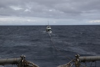 USS Kidd (DDG 100) tows a distressed fishing vessel.