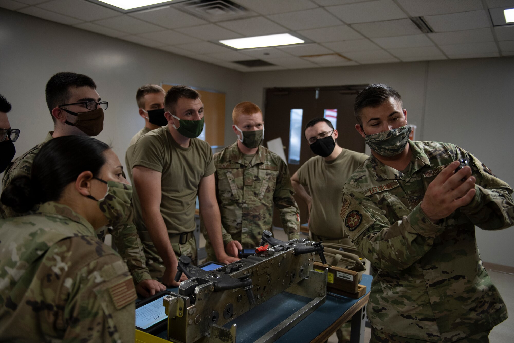 Airmen learn how to zero out a MAU-12 bomb rack pin protrusion gauge