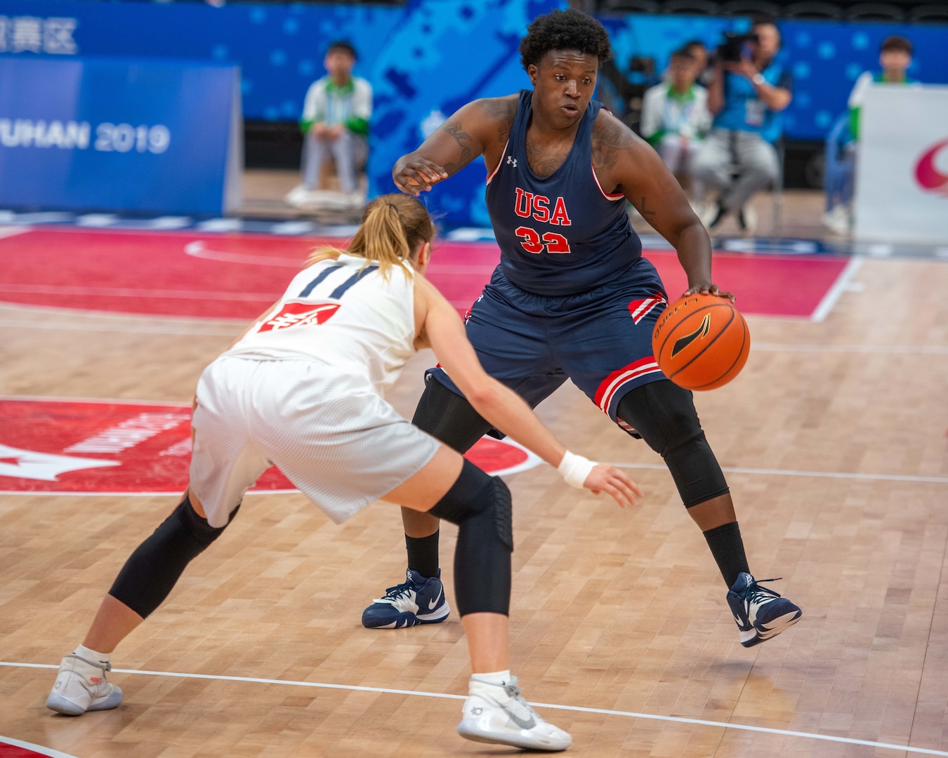 U.S. Air Force 2nd Lt. Charmaine Clark, U.S Armed Forces Women’s Basketball team member, looks to dribble past a defender during the 7th Council for International Sports for the Military World Games in Wuhan, China Oct. 19, 2019. The U.S. team defeated France 67 to 65. (U.S. DoD photo by Staff Sgt. Vito T. Bryant)