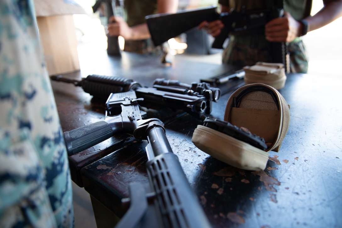 U.S. Marines with Marine Rotational Force - Darwin, clean weapons on Robertson Barracks, NT, Australia, June 30.