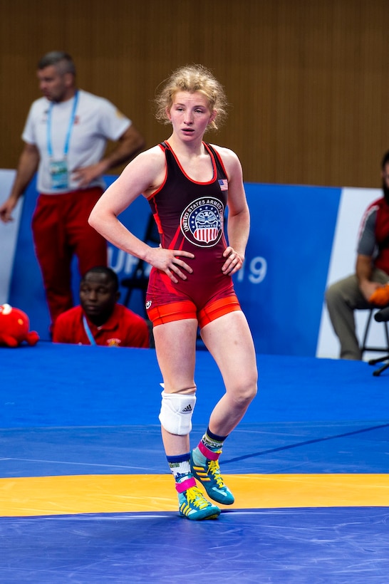 Staff Sgt. Whitney Conder with the U.S. Armed Forces Wrestling Team waits for a challenge review during her match against Nada Ashour of Egypt in the 50kg.weight class at the Military World Games in Wuhan, China, Oct. 22, 2019. Conder prevailed 11-0 and earned a silver medal in the games.  (DoD photo by Mass Communication Specialist 1st Class Ian Carver)