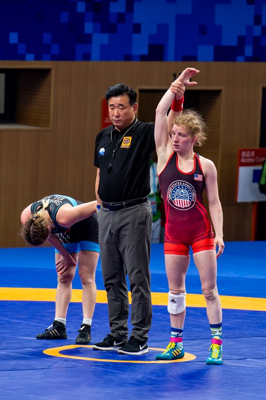 Army Staff Sgt. Whitney Conder with the U.S. Armed Forces Wrestling Team is announced as the victor against Kseniya Stankevich of Belarus, 9-2, in the 50kg. weight class at the Military World Games in Wuhan, China, Oct. 22, 2019. Conder earned a silver medal in the games. (DoD photo by Mass Communication Specialist 1st Class Ian Carver.)