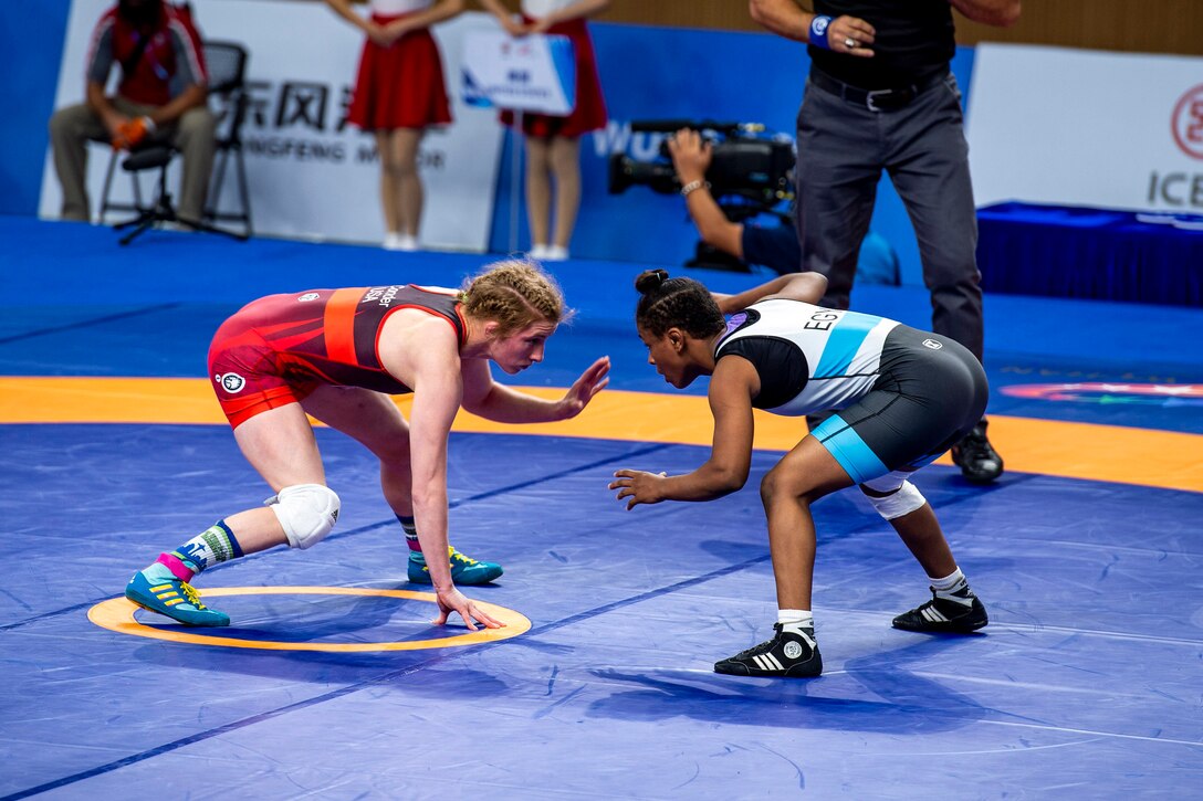 Army Staff Sgt. Whitney Conder with the U.S. Armed Forces Wrestling Team competes against Nada Ashour of Egypt in the 50kg weight class at the Military World Games in Wuhan, China, Oct. 22, 2019. Conder prevailed 11-0 and earned a silver medal in the games. (DoD photo by Mass Communication Specialist 1st Class Ian Carver)