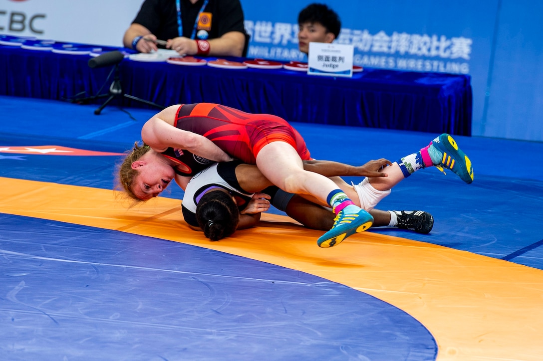 Army Staff Sgt. Whitney Conder with the U.S. Armed Forces Wrestling Team competes against Nada Ashour of Egypt in the 50kg. weight class at the Military World Games in Wuhan, China, Oct. 22, 2019. Conder prevailed 11-0 and earned a silver medal in the games. (DoD photo by Mass Communication Specialist 1st Class Ian Carver)