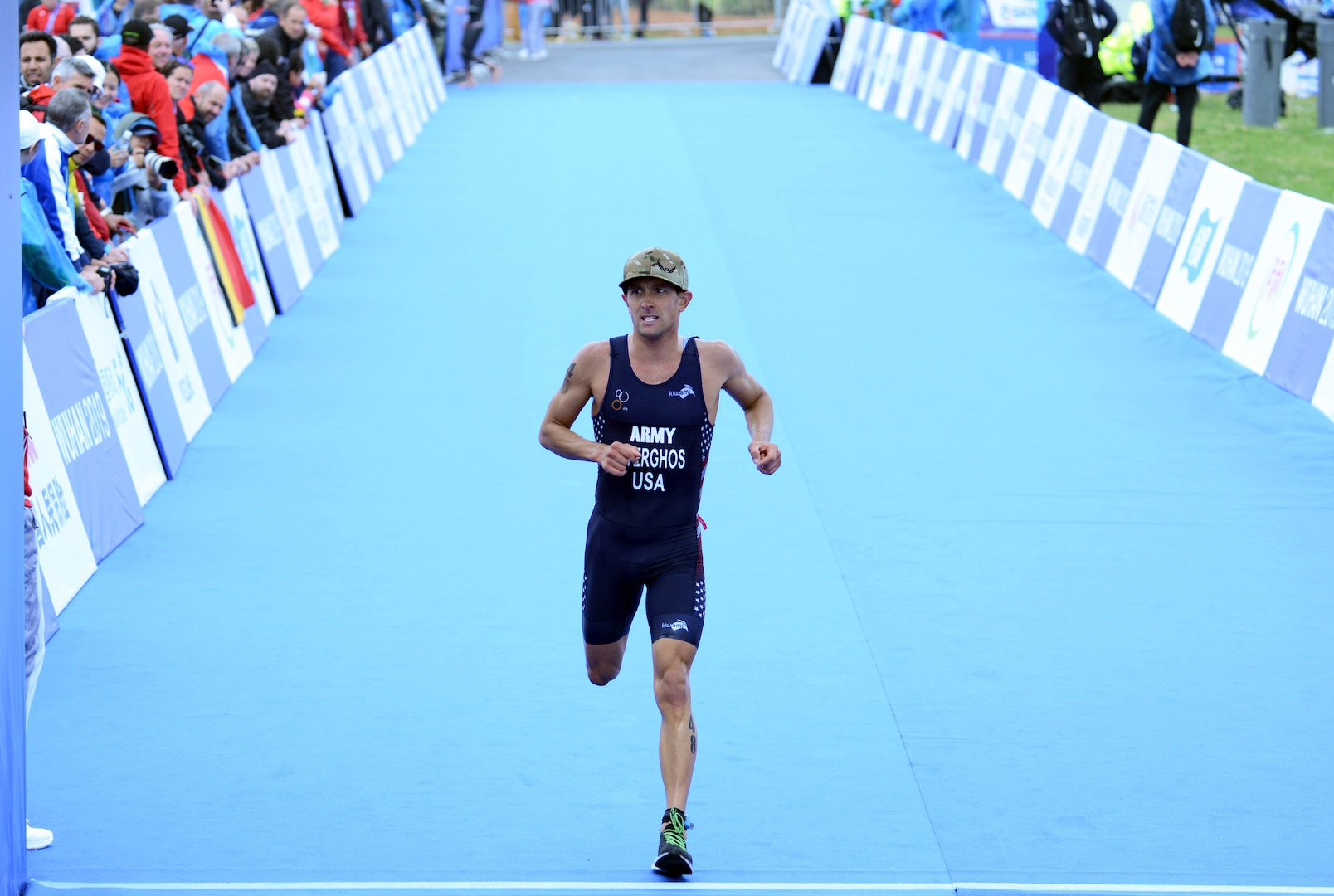USA triathlon competitor Army Capt. Nicholas Sterghos of Fort Carson, Colo., crosses the finish line of the men's triathlon at the Military World Games in Wuhan, China, Oct. 27, 2019 with a time of 1:49:56.