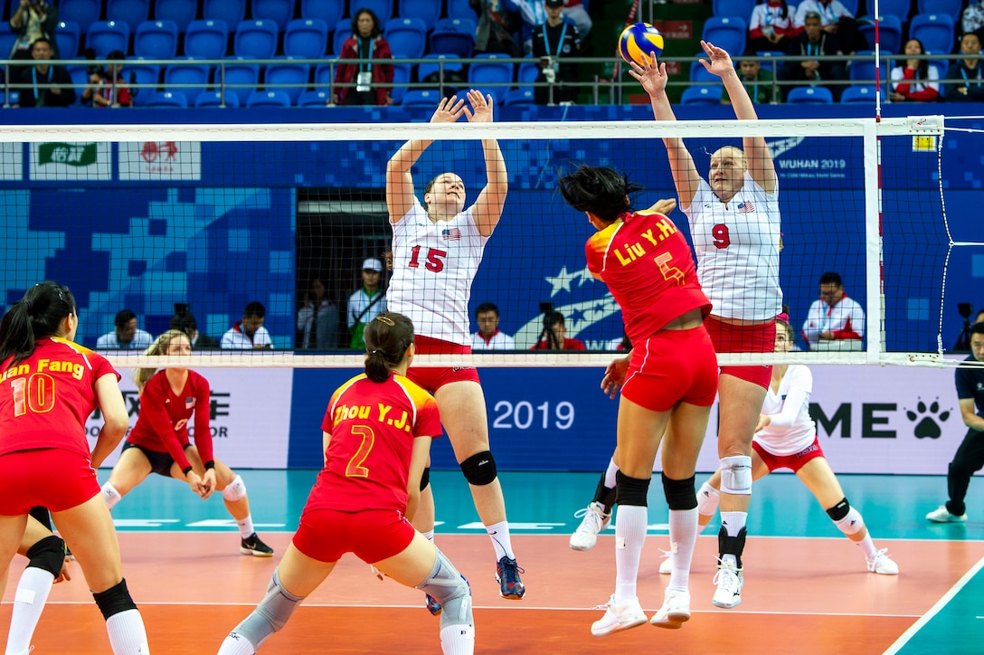 Kylie Churches (15) and Abbey Hall (9) block a shot during the U.S. Armed Forces Women’s Volleyball Team match against China in the first preliminary round of the CISM 2019 Military World Games in Wuhan, China Oct. 16, 2019.  (DoD photo by Mass Communication Specialist 1st Class Ian Carver/RELEASED)