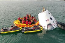 Airmen execute open water rescue training.