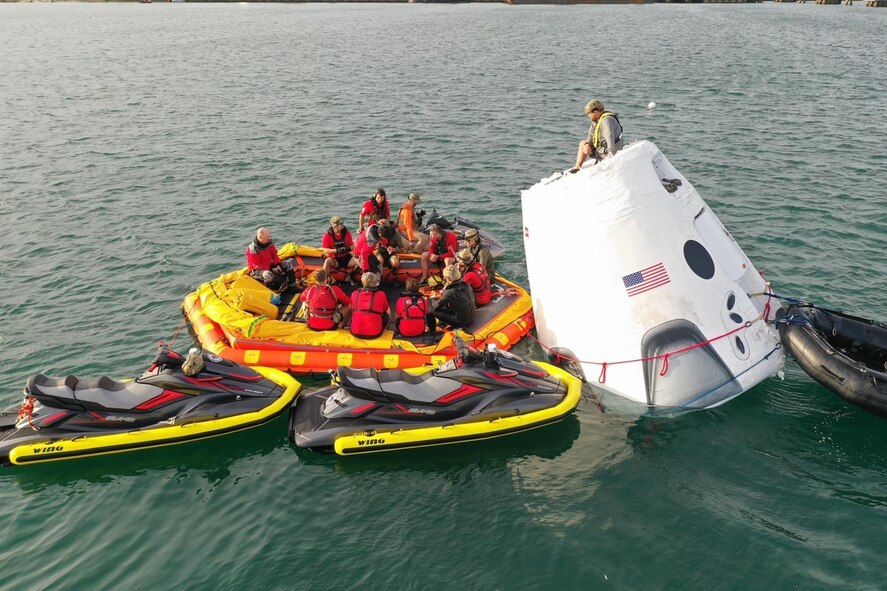 Airmen execute open water rescue training.