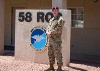 Airman poses for photo.