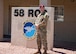 Airman poses for photo.