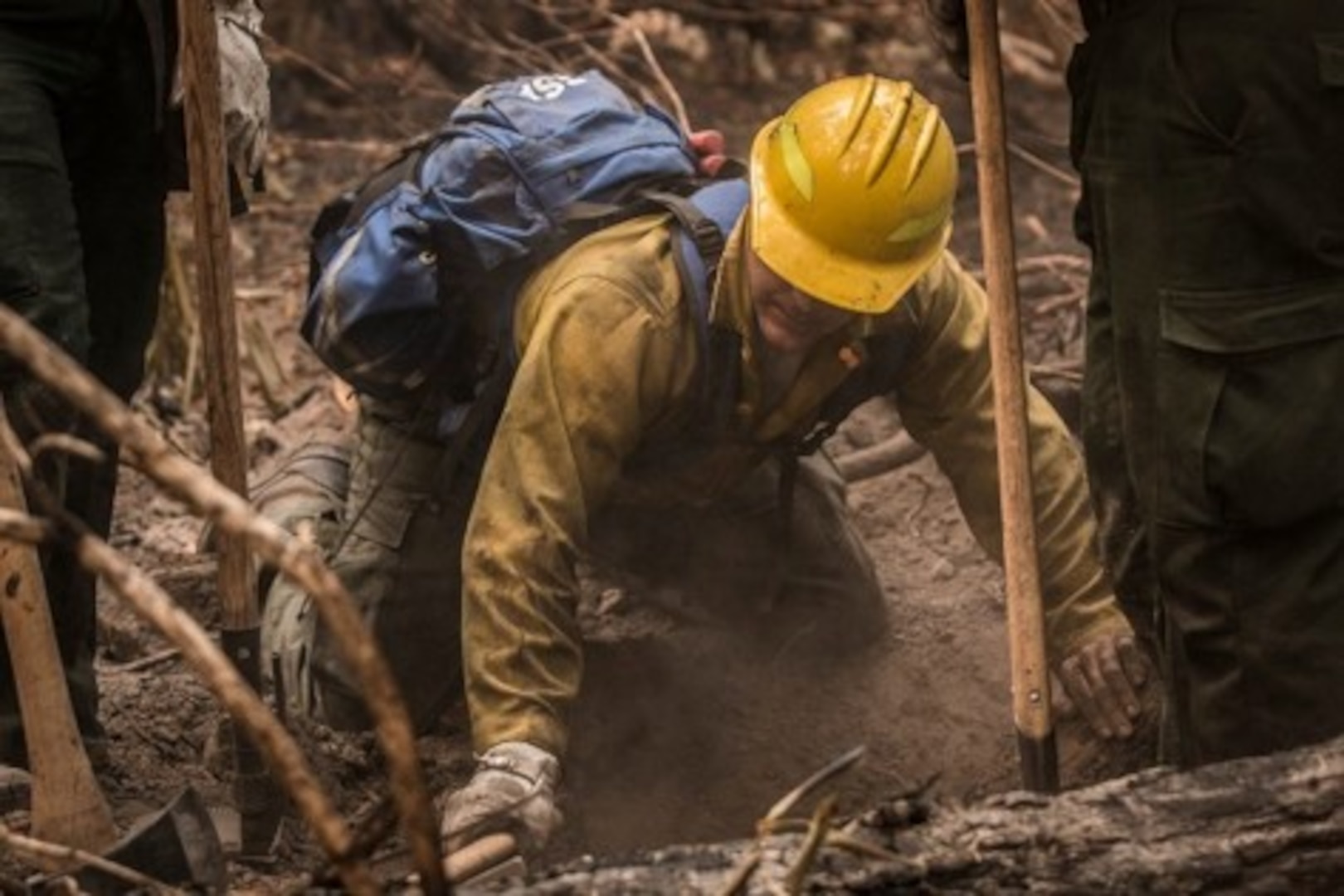 A U.S. Army Soldier deployed in support of wildland firefighting for the National Interagency Fire Center helps complete mop-up operations that are important to extinguishing and containing wildland fires.