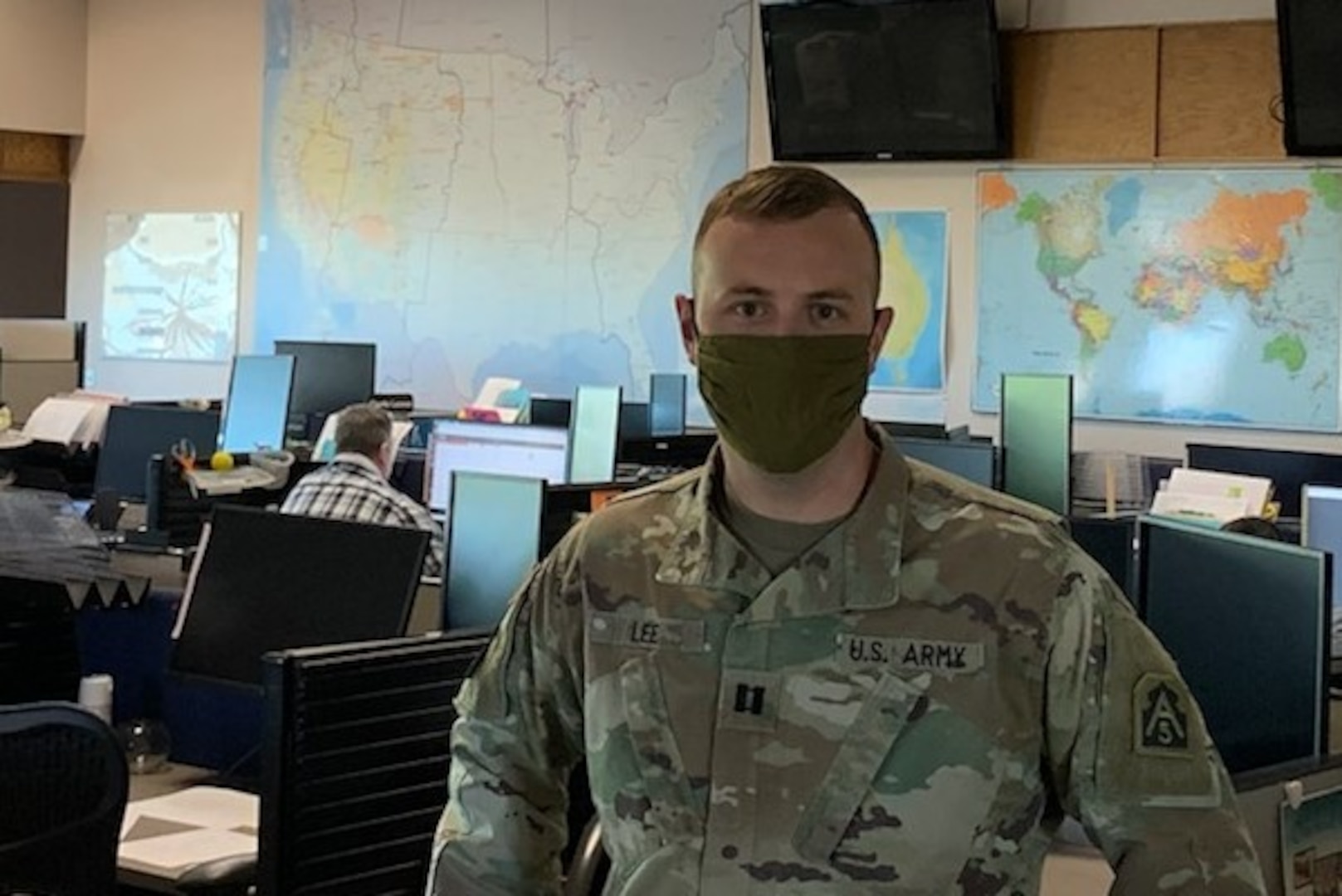 U.S. Army Capt. Erickson Lee, the U.S. Army North Defense Support to Civil Authorities plans officer who works with the Federal Emergency Management Agency Defense Coordinating Element in Region 10, stands in the National Interagency Fire Center operations room in Boise, Idaho, July 1, 2020. Lee deployed to the NIFC for the summer fire season from Anchorage, Alaska, where he is stationed.