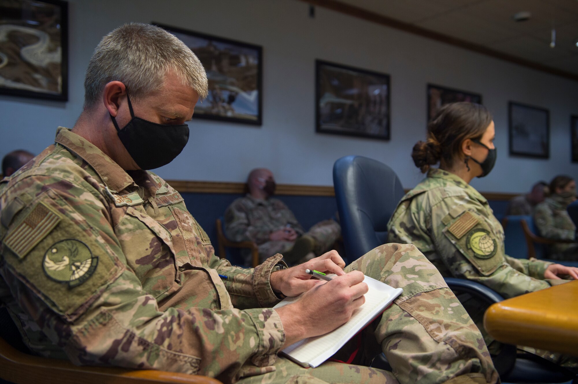 Members of the 621st Contingency Response Wing leadership listen and take notes to diversity and inclusion guest speaker Risha Grant during a one-hour diversity and inclusion meeting June 30, 2020, at Joint Base McGuire-Dix-Lakehurst, N.J. With mounting racial tensions across the United States, senior leaders are taking extra measures to understand and help improve the workplace environment for their Airmen.