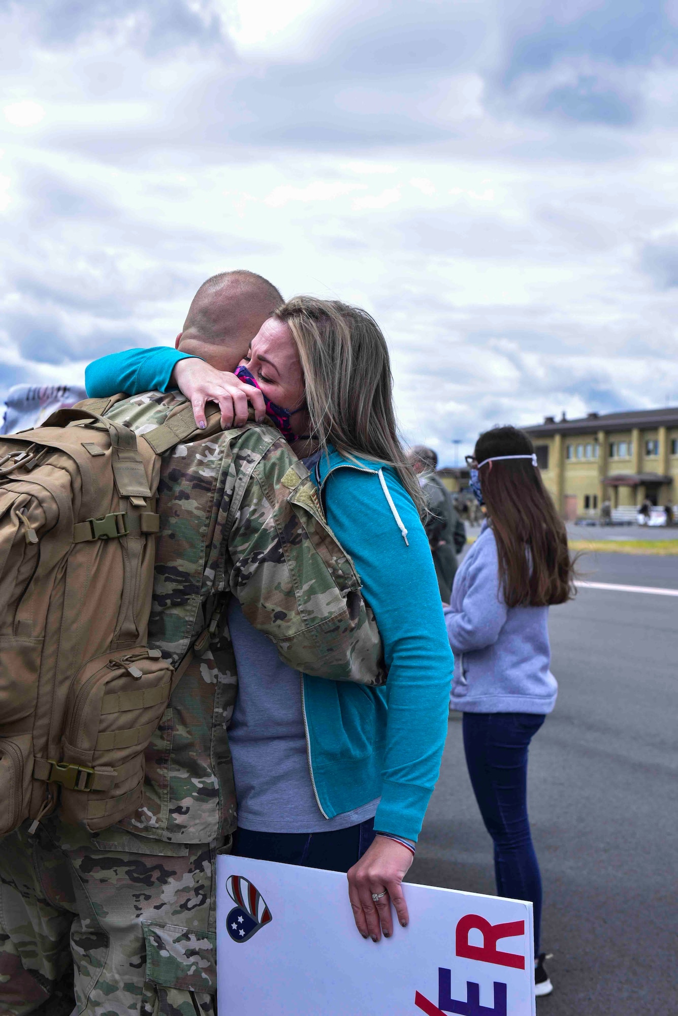 A 93rd Air Refueling Squadron member arrives home from a deployment and is greeted by a loved one on Fairchild Air Force Base, Washington, July 1, 2020. The Airmen left home for a four-month deployment but due to coronavirus disease 2019 health and safety restrictions, members returned after seven months. (U.S. Air Force photo by Airman 1st Class Kiaundra Miller)