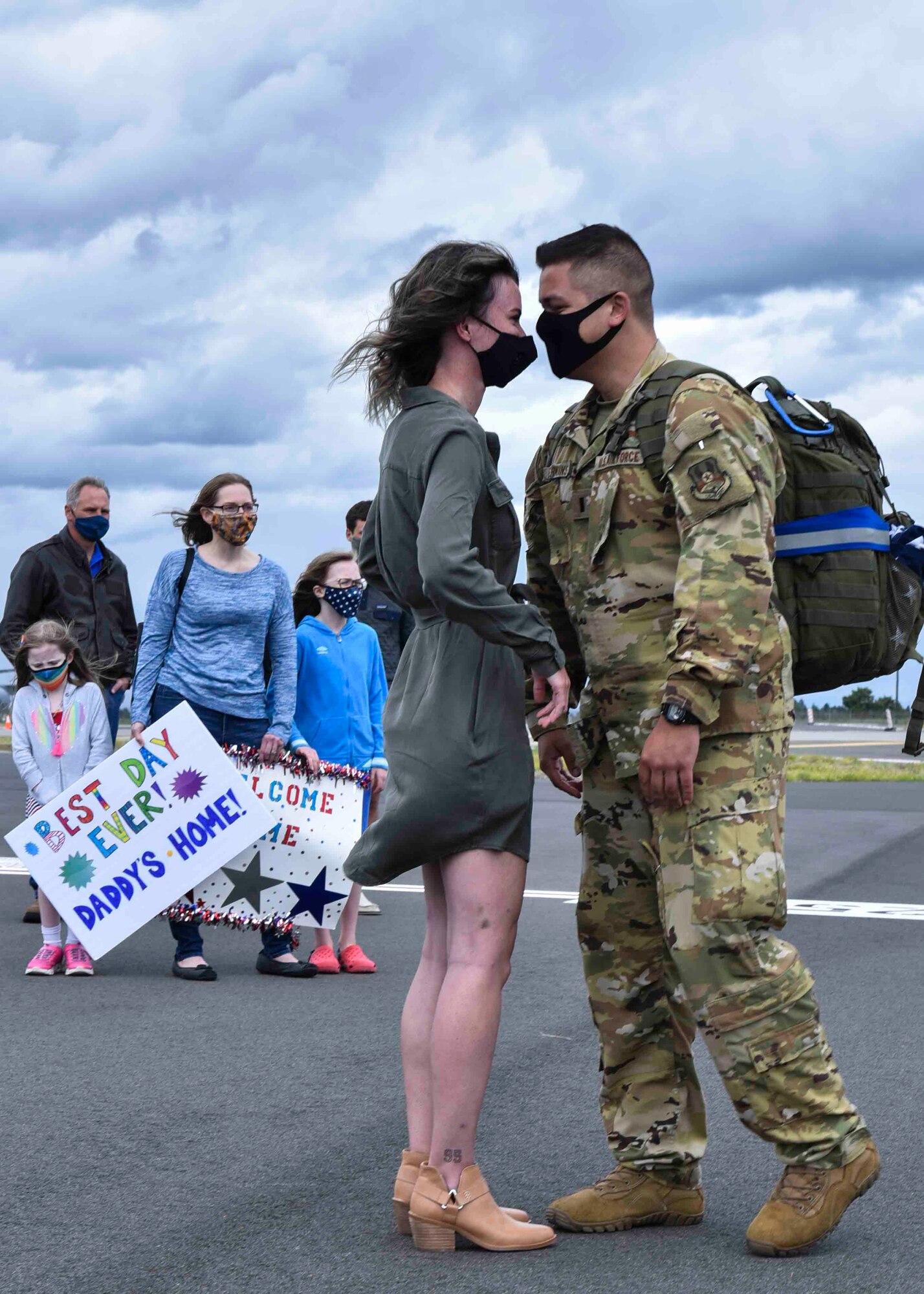 A 93rd Air Refueling Squadron member arrives from deployment and greets his loved one on Fairchild Air Force Base, Washington, July 1, 2020. Seventy-six members of the 93rd ARS deployed for seven months in support of Operation Inherent Resolve. (U.S. Air Force photo by Airman 1st Class Kiaundra Miller)