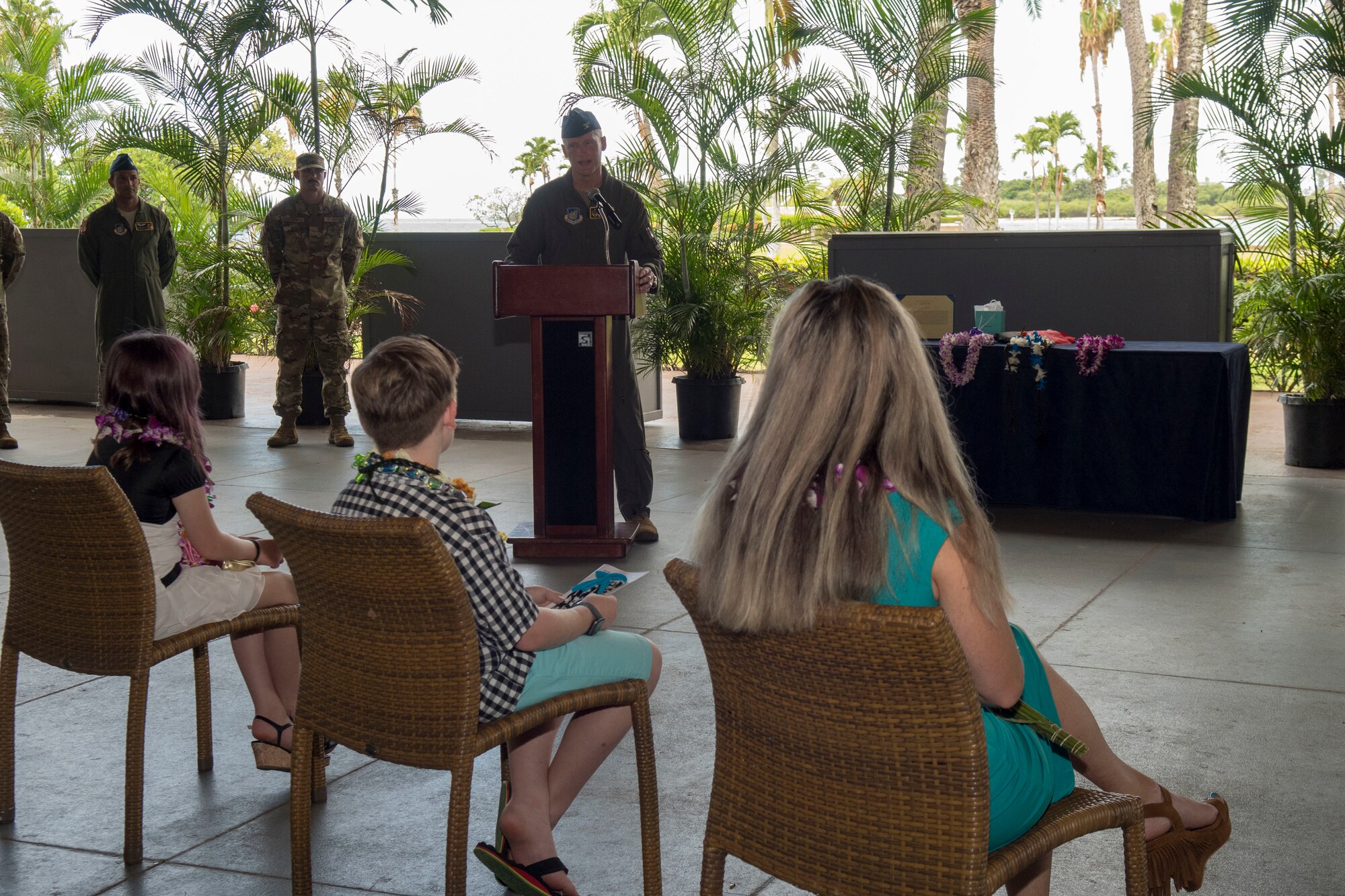 Col. Jason Rueschhoff, outgoing 613th Air Operations Center commander and current Pacific Air Forces commander’s senior executive officer, addresses his family during the 613th AOC change of command ceremony, Joint Base Pearl Harbor-Hickam, Hawaii, June 29, 2020. Rueschhoff relinquished command of the 613th AOC to Col. Nicholas Evans. (U.S. Air Force photo by Staff Sgt. Mikaley Kline)
