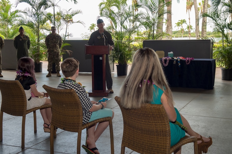 Col. Jason Rueschhoff, outgoing 613th Air Operations Center commander and current Pacific Air Forces commander’s senior executive officer, addresses his family during the 613th AOC change of command ceremony, Joint Base Pearl Harbor-Hickam, Hawaii, June 29, 2020. Rueschhoff relinquished command of the 613th AOC to Col. Nicholas Evans. (U.S. Air Force photo by Staff Sgt. Mikaley Kline)