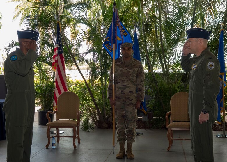 Col. Nicholas Evans, 613th Air Operations Center commander, salutes Gen. CQ Brown, Jr., Pacific Air Forces commander, during the 613th AOC change of command ceremony, Joint Base Pearl Harbor-Hickam, Hawaii, June 29, 2020. Evans most recently served as the commander of the 8th Operations Group, Kunsan Air Base, Republic of Korea. (U.S. Air Force photo by Staff Sgt. Mikaley Kline)