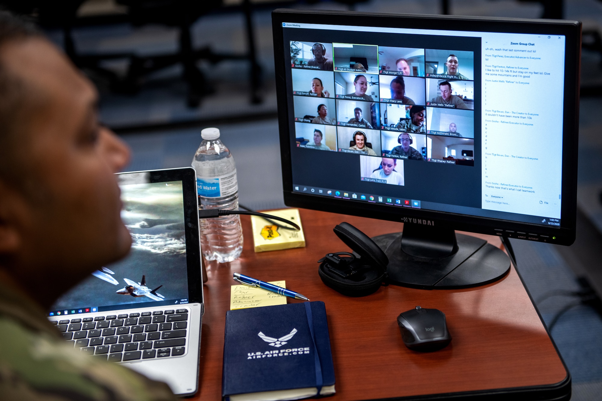 U.S. Air Force Tech. Sgt. Kurt Alie (left), Robert D. Gaylor Non-Commissioned Officer Academy student instructor, receives an evaluation from Tech. Sgt. Michael Napieraj, instructor trainer, while Tech. Sgt. Alie’s virtual class takes a break June 23, 2020, at Joint Base San Antonio-Lackland, Texas.