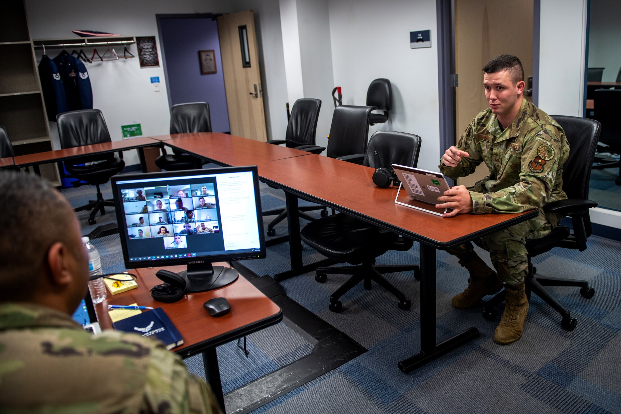 U.S. Air Force Tech. Sgt. Kurt Alie (left), Robert D. Gaylor Non-Commissioned Officer Academy (NCOA) student instructor, receives an evaluation from Tech. Sgt. Michael Napieraj, instructor trainer, while Tech. Sgt. Alie’s virtual class takes a break June 23, 2020, at Joint Base San Antonio-Lackland, Texas.