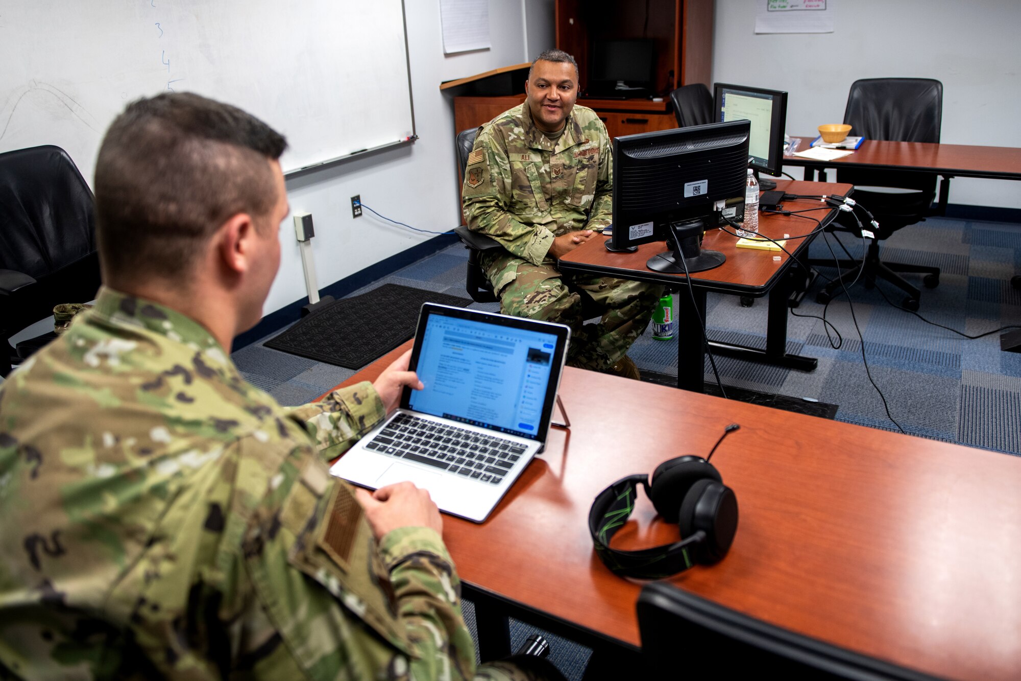 U.S. Air Force Tech. Sgt. Kurt Alie (right), Robert D. Gaylor Non-Commissioned Officer Academy student instructor, receives an evaluation from Tech. Sgt. Michael Napieraj, instructor trainer, while Tech. Sgt. Alie’s virtual class takes a break June 23, 2020, at Joint Base San Antonio-Lackland, Texas.