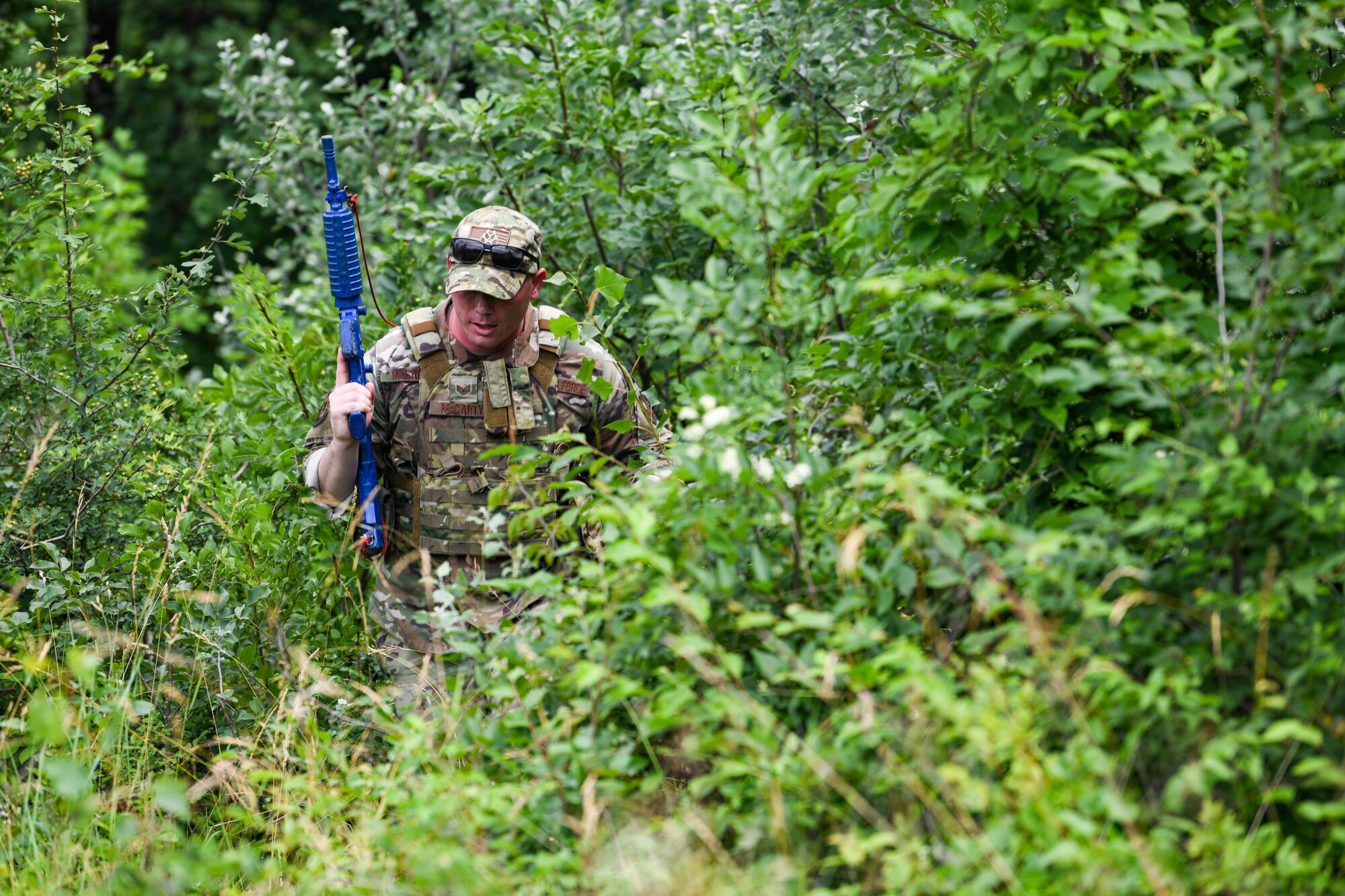U.S. Air Force Staff Sgt. Matthew McCarty, 31st Security Forces Squadron military working dog handler searched for a simulated downed pilot during Operation Porcupine, June 30, 2020 at Osoppo, Italy. McCarty acted as the opposing force during Operation Porcupine which is a unique exercise that tests the diverse capabilities of the 31st Operations Group, combining efforts from the 56th and 57th Rescue Squadron, the 510th Fighter Squadron, the 606th Air Control Squadron, and the 31st Security Forces Squadron for the rescue of a simulated downed pilot. (U.S. Air Force photo by Airman 1st Class Ericka A. Woolever)