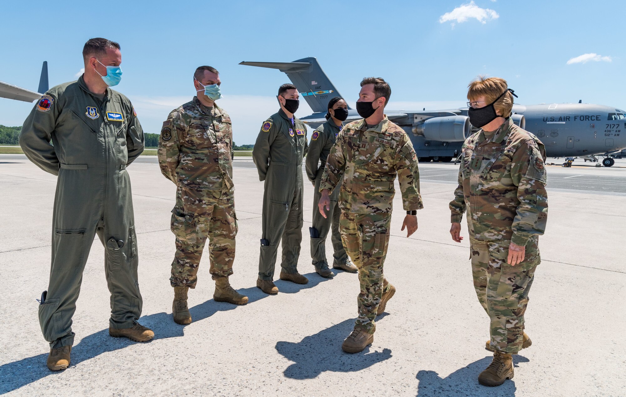 Capt. Travis Parrot, 3rd Airlifter Squadron pilot and stage representative, escorts Lt. Gen. Dorothy Hogg, U.S. Air Force surgeon general, onto a C-17 Globemaster III, June 26, 2020, at Dover Air Force Base, Delaware. Hogg was briefed on the Transport Isolation System and met with 10th Expeditionary Aeromedical Evacuation Flight aircrew, the TIS support team and 736th Aircraft Maintenance Squadron personnel. (U.S. Air Force photo by Roland Balik)