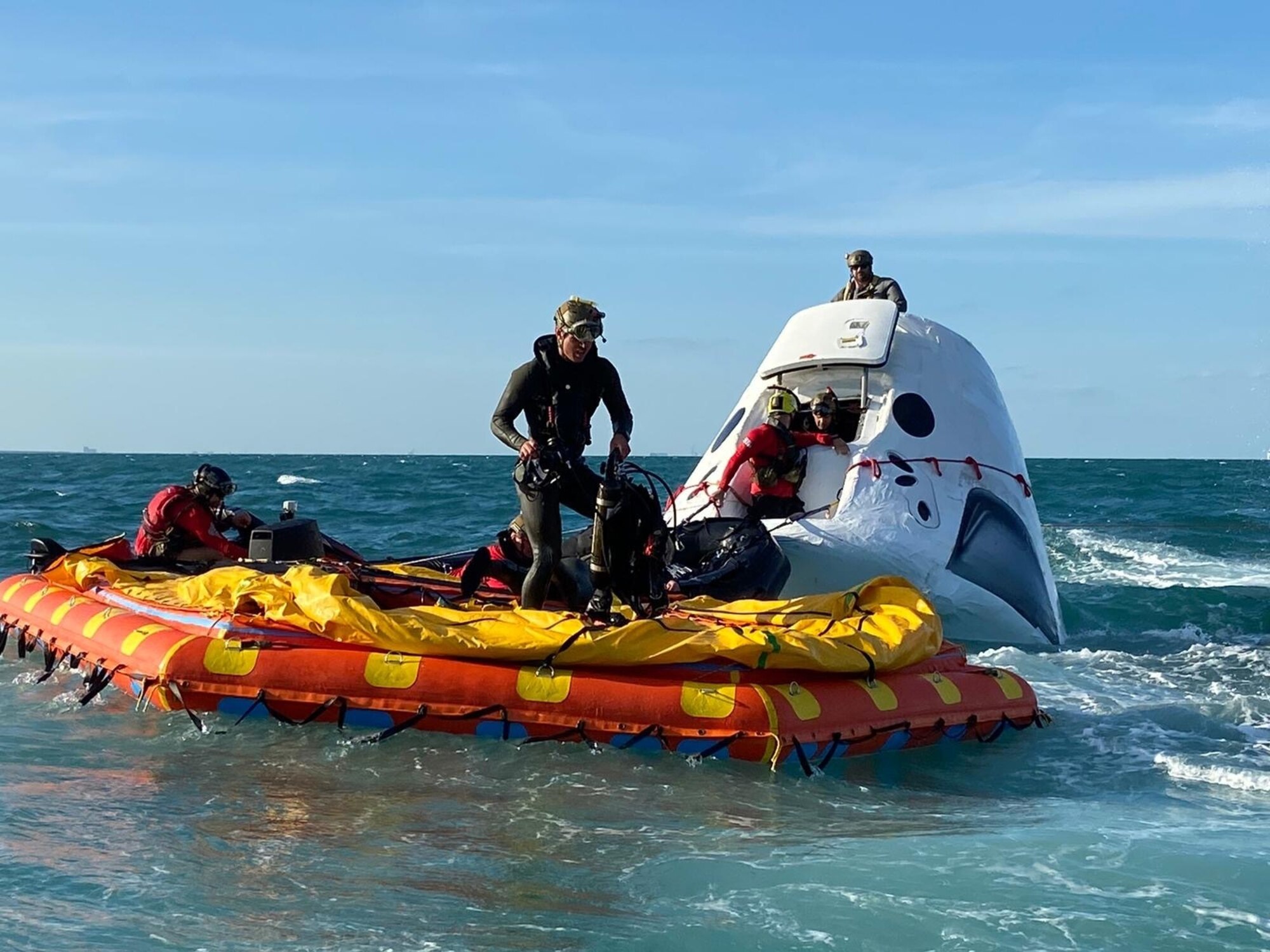 Airmen execute open water rescue training.