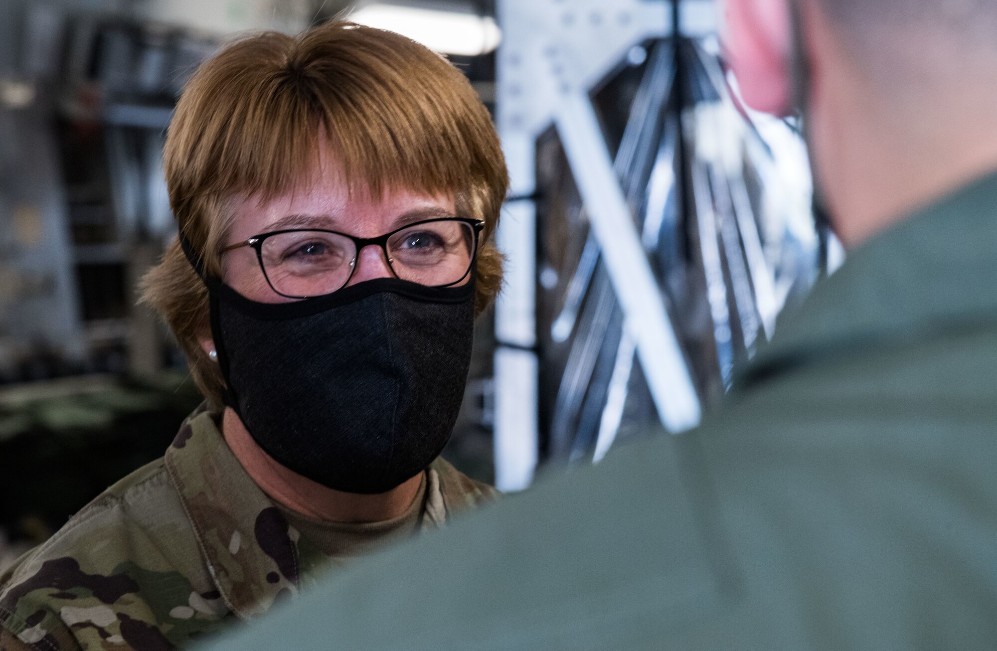 Lt. Gen. Dorothy Hogg, U.S. Air Force surgeon general, speaks with a 10th Expeditionary Aeromedical Evacuation Flight aircrew member June 26, 2020, at Dover Air Force Base, Delaware. Dover serves as the U.S. East Coast hub for the Transport Isolation System. (U.S. Air Force photo by Roland Balik)