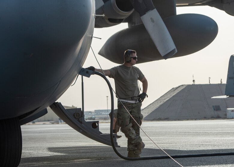 stands next to a C-130
