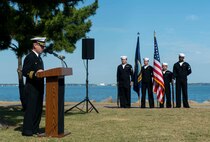 Cmdr. E. J. Pledger, the commanding officer of the guided-missile destroyer USS Cole (DDG 67), delivers remarks during a memorial ceremony.