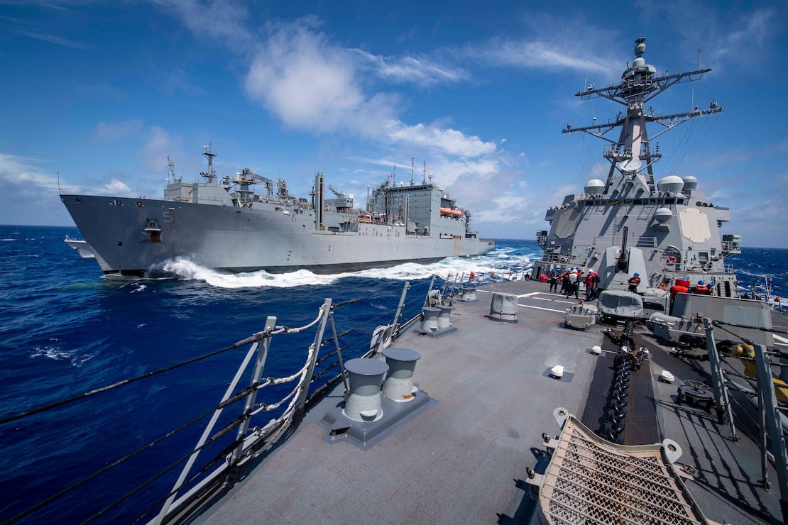 USS Gridley (DDG 101), right, steams alongside the Lewis and Clark-class dry cargo ship USNS Robert E. Peary (T-AKE 5) during a replenishment-at-sea.