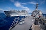 USS Gridley (DDG 101), right, steams alongside the Lewis and Clark-class dry cargo ship USNS Robert E. Peary (T-AKE 5) during a replenishment-at-sea.