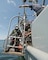 Navy divers assigned to Mobile Diving and Salvage Unit (MDSU) 2 enter the water over the wreck of the World War I ship USS San Diego (ACR 6).