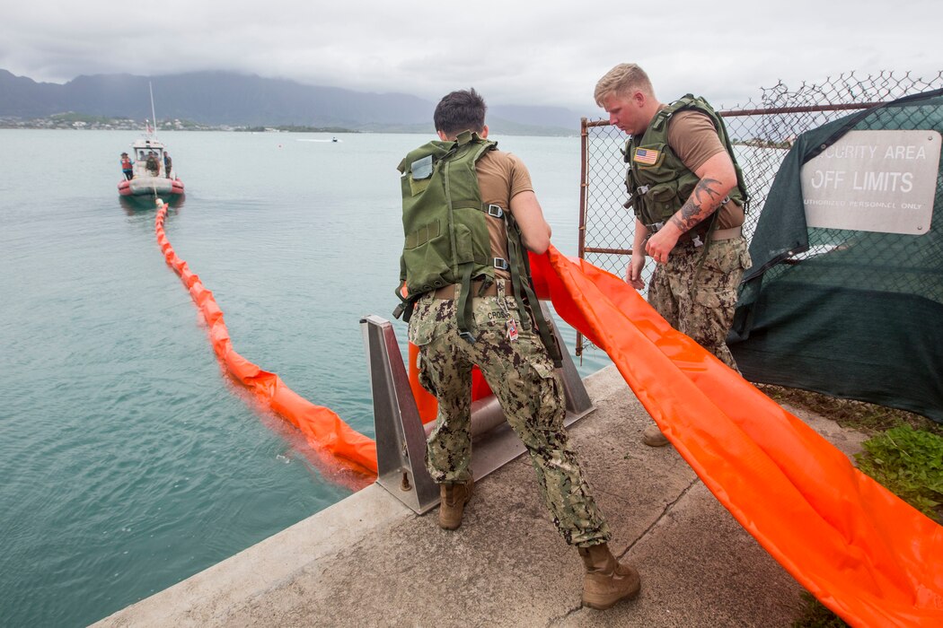 Waterfront Operations Facility Response Team conduct annual training exercises deploying spill containment boom in Kaneohe Bay. Personnel train to effectively respond and contain potential oil spills aboard MCBH. It prevents oil pollution and protects our surrounding waters. Other federal, state, and local agency responders participate in exercises alongside MCBH in the National Preparedness for Response Exercise Program (PREP).