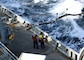 USNS Arctic recieves a fuel line from USNS Laramie