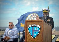 Rear Adm. Cedric E. Pringle, commander of Expeditionary Strike Group (ESG) 3, delivers remarks during a USS Cole Remembrance Ceremony aboard the USS Midway Museum in San Diego, Calif., Oct. 12, 2018.