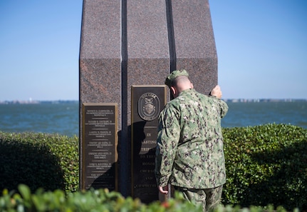 A Sailor visits the Cole Memorial on the 18th anniversary of the attack on the ship.