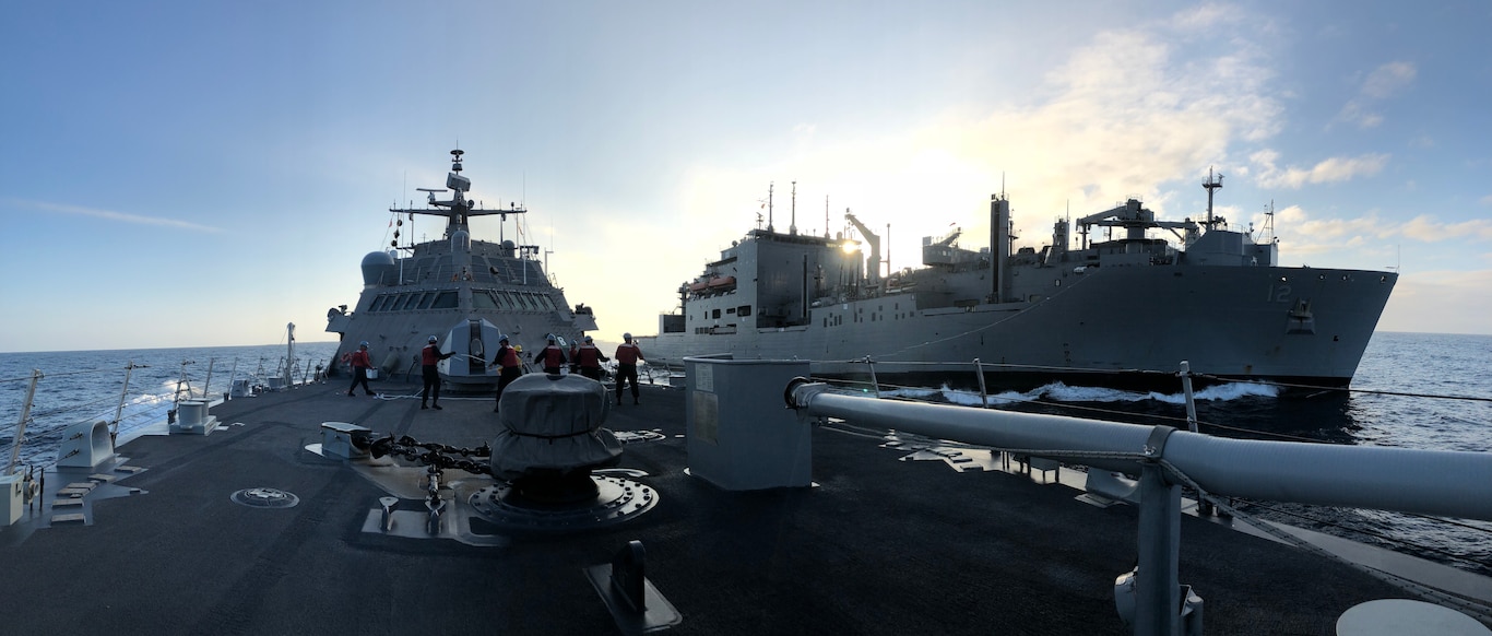 Sailors aboard the Freedom-class littoral combat ship USS Detroit (LCS 7) conduct a replenishment-at-sea with the Lewis and Clark-class dry cargo and ammunition ship USNS William McLean (T-AKE 12).