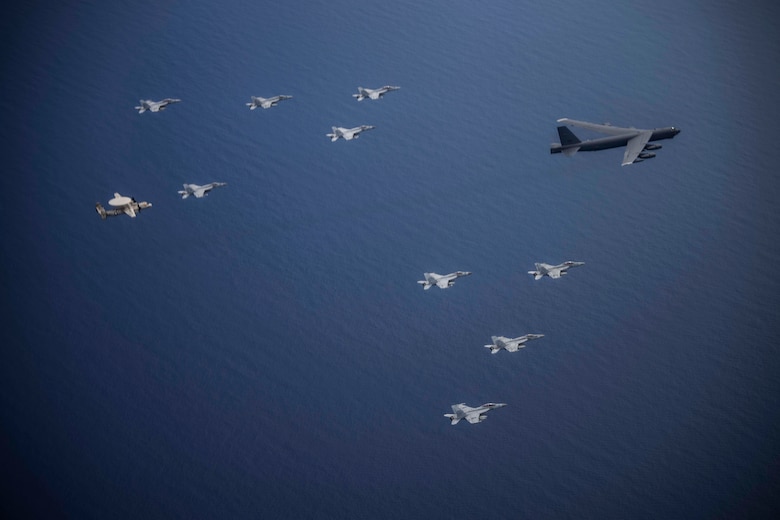 Aircraft from the Nimitz Carrier Strike Force and a B-52 Bomber from Barksdale Air Force base conduct integrated joint air operations in support of a free and open Indo-Pacific. The USS Nimitz (CVN 68) and USS Ronald Reagan (CVN 76) Carrier Strike Groups are conducting dual-carrier operations in the South China Sea as the Nimitz Carrier Strike Force. (U.S. Navy photo by Lt. Cmdr. Joseph Stephens)