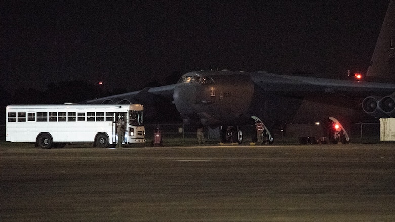 Barksdale aircrew exit a bus before taking off in a B-52H Stratofortress from Barksdale Air Force Base, La., in support of a U.S. Strategic Command Bomber Task Force, July 2, 2020. BTF missions familiarize aircrews with air bases, procedures and operations in different Geographic Combatant Command’s areas of operations. (U.S. Air Force photo by Senior Airman Tessa B. Corrick)
