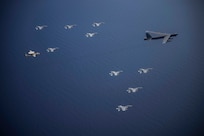 Aircraft from the Nimitz Carrier Strike Force and a B-52 Bomber from Barksdale Air Force base conduct integrated joint air operations in support of a free and open Indo-Pacific. The USS Nimitz (CVN 68) and USS Ronald Reagan (CVN 76) Carrier Strike Groups are conducting dual-carrier operations in the South China Sea as the Nimitz Carrier Strike Force. (U.S. Navy photo by Lt. Cmdr. Joseph Stephens)