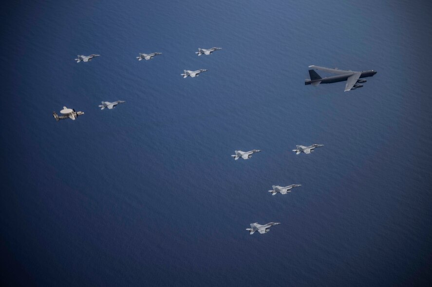 Aircraft from the Nimitz Carrier Strike Force and a B-52 Bomber from Barksdale Air Force base conduct integrated joint air operations in support of a free and open Indo-Pacific. The USS Nimitz (CVN 68) and USS Ronald Reagan (CVN 76) Carrier Strike Groups are conducting dual-carrier operations in the South China Sea as the Nimitz Carrier Strike Force. (U.S. Navy photo by Lt. Cmdr. Joseph Stephens)
