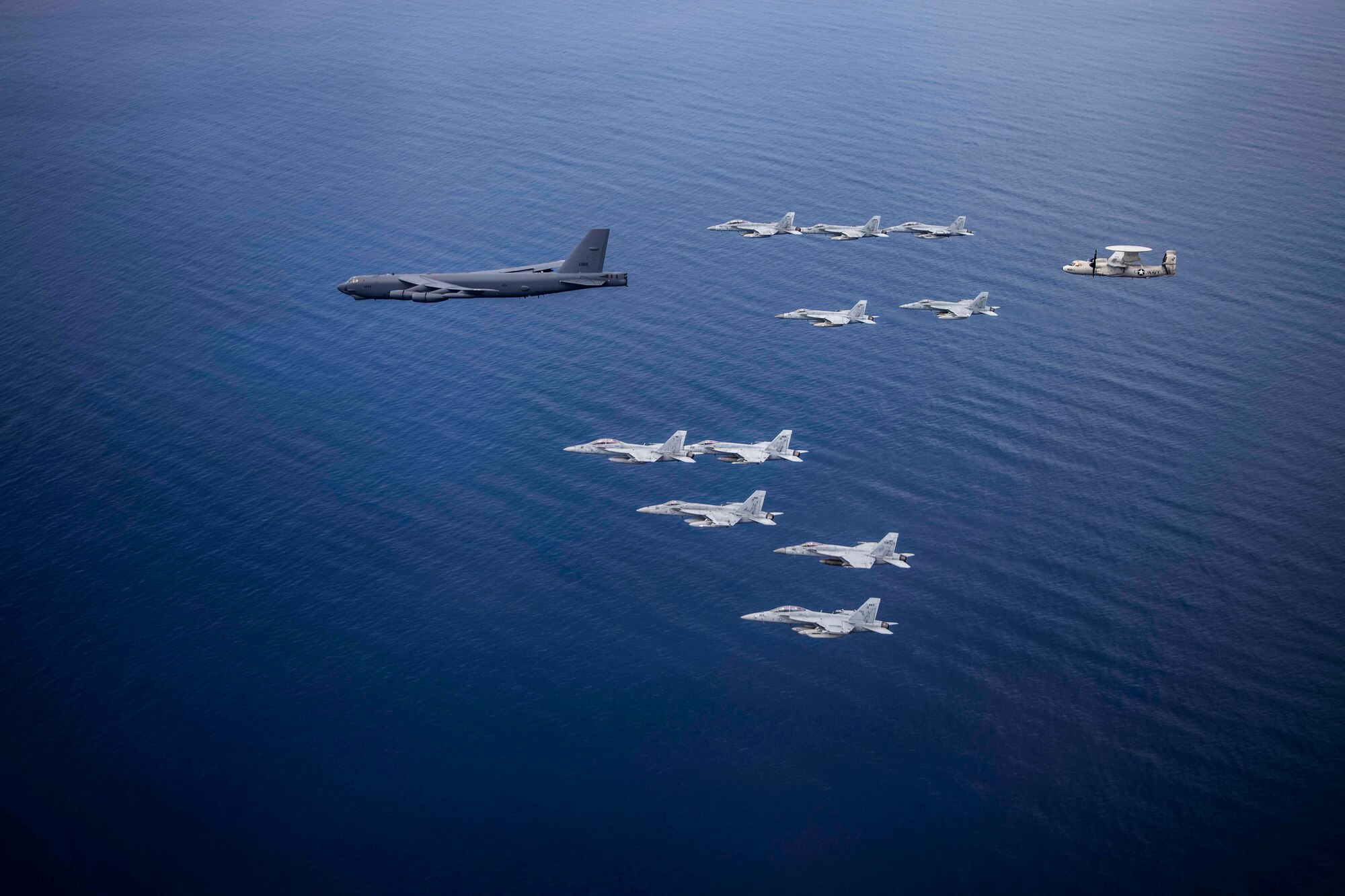 Aircraft from the Nimitz Carrier Strike Force and a B-52 Bomber from Barksdale Air Force base conduct integrated joint air operations in support of a free and open Indo-Pacific. The USS Nimitz (CVN 68) and USS Ronald Reagan (CVN 76) Carrier Strike Groups are conducting dual-carrier operations in the South China Sea as the Nimitz Carrier Strike Force. (U.S. Navy photo by Lt. Cmdr. Joseph Stephens)