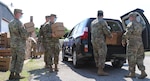 The Kansas National Guard and volunteers hand out boxes of fresh produce and dry goods at a food pantry in Effingham, Kansas, June 22, 2020. The food pantry is held once a month at different locations to meet the growing food demand caused by the COVID-19 pandemic.
