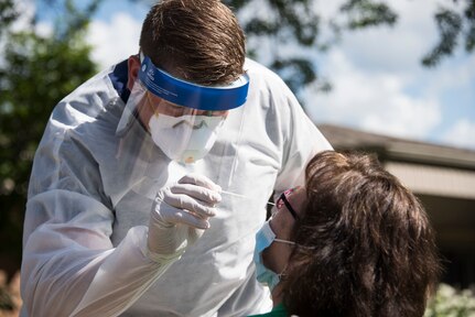 A medic from the Indiana National Guard tests for COVID-19 at the Greenwood Healthcare Center on June 24, 2020. The Indiana National Guard assisted OptumServe with statewide testing of more than 47,000 employees at 520 long-term care facilities as part of a new initiative by the Indiana State Department of Health, June 10 to 28.