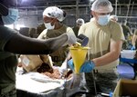 Members of the Kansas National Guard pack, weigh, seal and box food bags n Leawood, Kansas, June 25, 2020, to meet the growing food demand caused by the COVID-19 pandemic. The food is distributed at food pantries throughout Kansas.