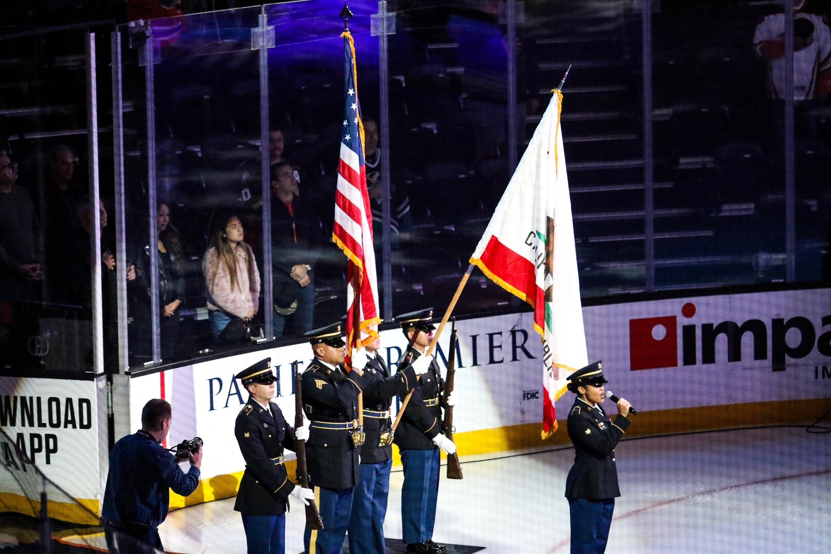 U.S. Army Spc. Raivyn Hearne of the California Army National Guard's 40th Infantry Division Band sings the national anthem during the Anaheim Ducks Military Appreciation Night, Nov. 10, 2019, at the Honda Center in Anaheim, California.