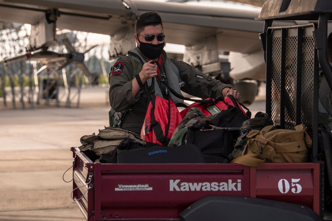 A photo of a pilot unloading gear